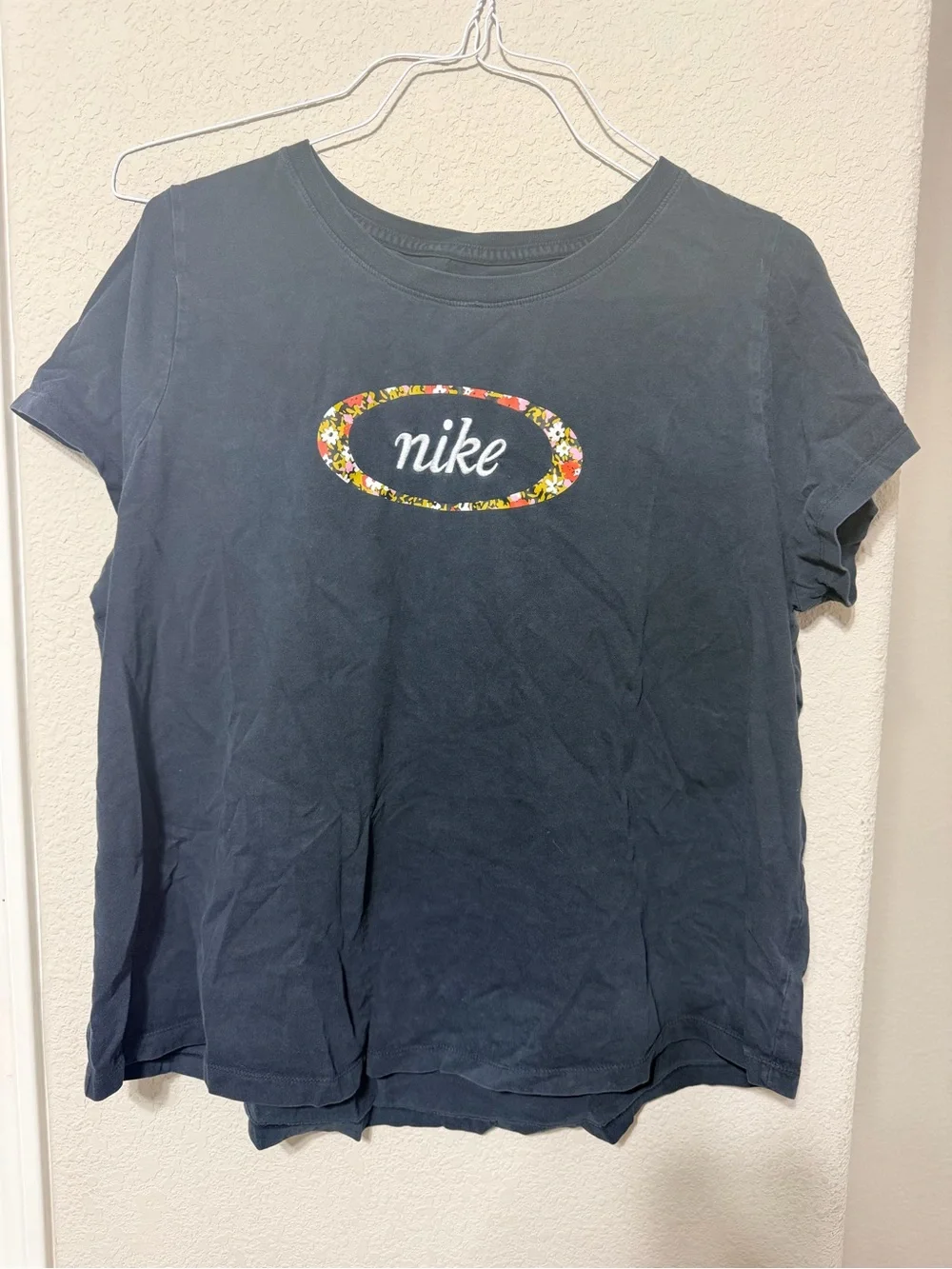 Nike Black Short-Sleeve Logo Tee with Floral Oval